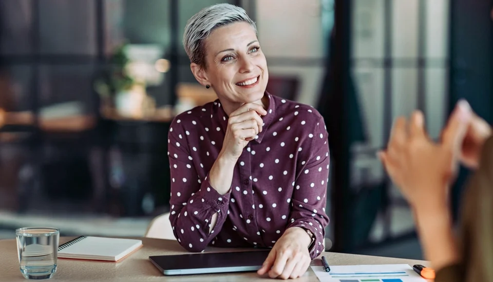 Boss listening closely to an employee