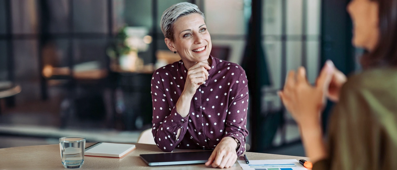 Boss listening closely to an employee